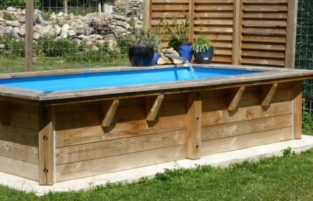 Espace plage verte avec petite piscine, où les enfants se rafraîchissent, et les parents peuvent siroter leur cocktail au bord de l'eau. Gîte n°421 Chauffry - Seine-et-Marne - Espace plage verte avec petite piscine, où les enfants se rafraîchissent, et les parents peuvent siroter leur cocktail au bord de l'eau.